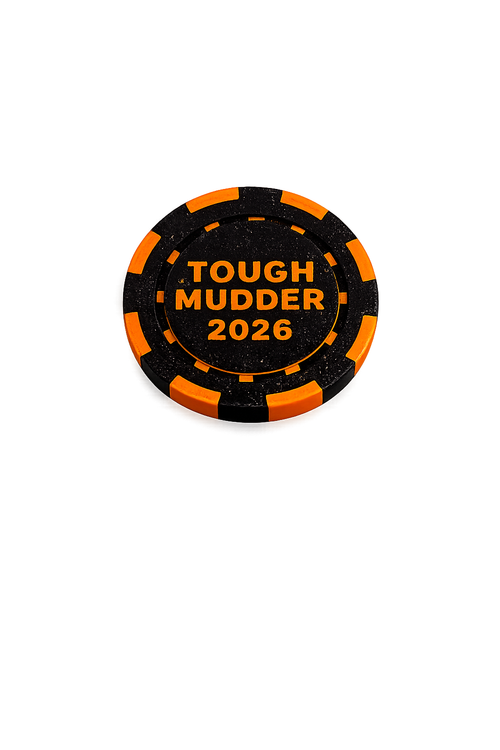 Close-up of a Tough Mudder 2026 honor coin, engraved with the event name