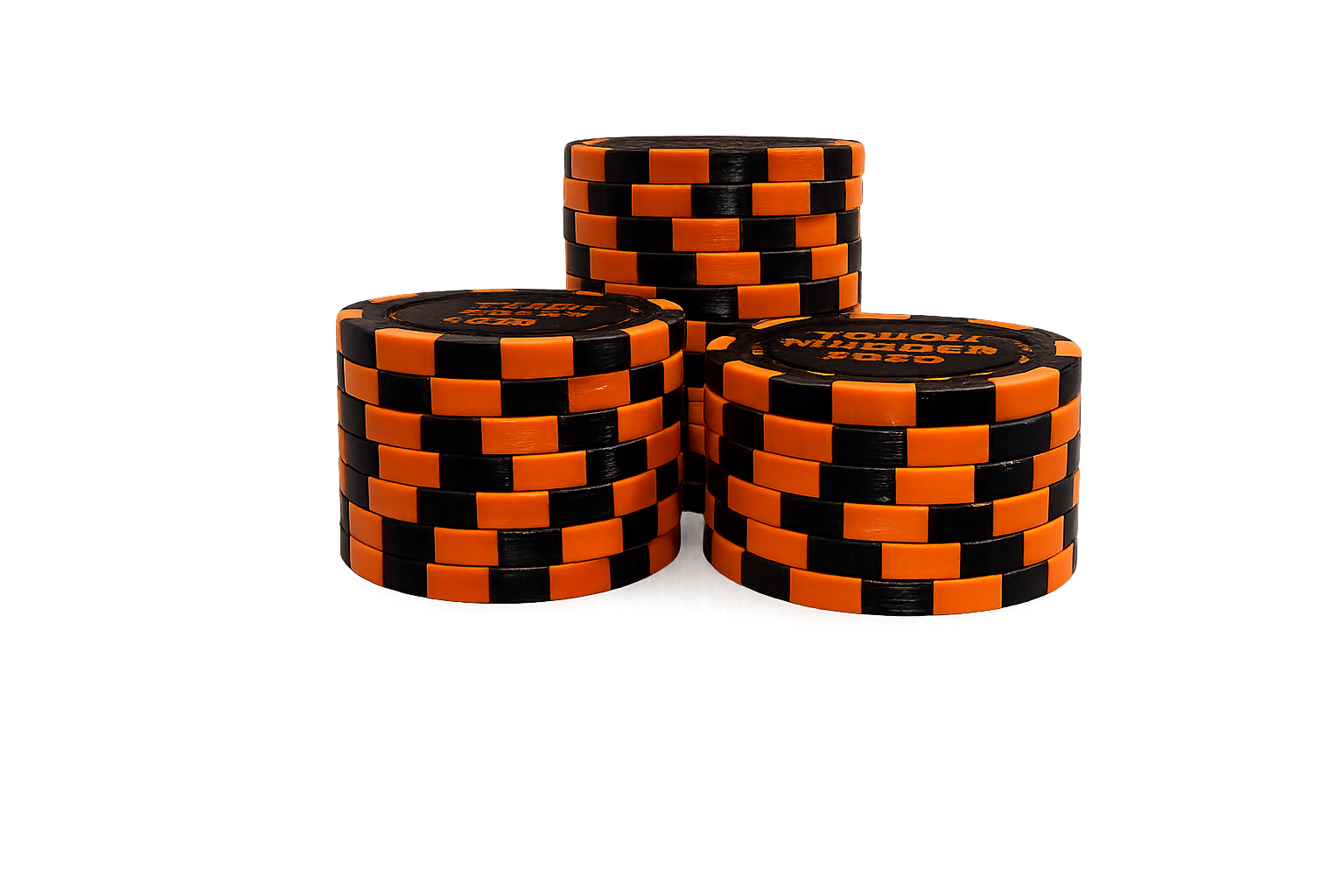 Three stacks of black and orange Tough Mudder 2026 honor coins